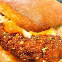 Drunken Parm · with vodka sauce & mozzarella cheese on our garlic toasted house roll. . Meatball also inclu...