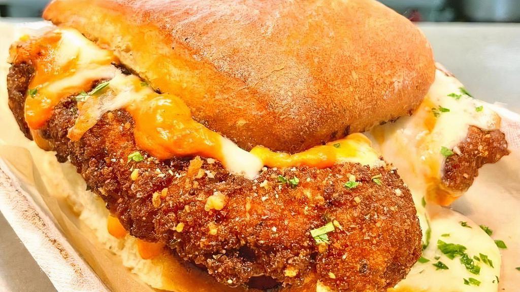 Drunken Parm · with vodka sauce & mozzarella cheese on our garlic toasted house roll. . Meatball also includes provolone cheese.