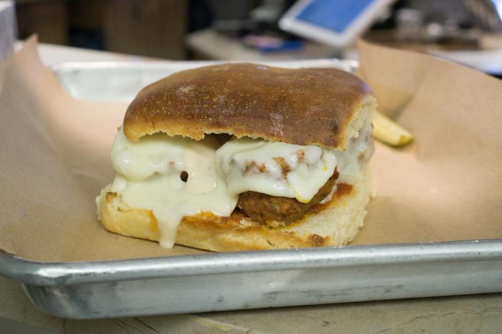 Tomato Basil Parm · Protein of your choice with tomato basil sauce & mozzarella cheese on our garlic toasted house roll. . Meatball also includes provolone cheese.
