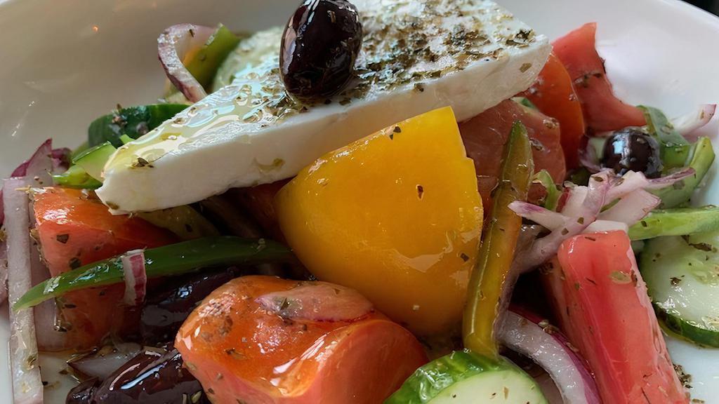 Greca Salad · Gluten free. Heirloom tomatoes, English cucumbers, red onion, kalamata olives, green peppers, epirus feta, extra-virgin olive oil, red wine vinegar, and oregano.