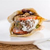 Falafel Sandwich · Vegetarian. Falafel, lettuce, tomato, sun dried tomato, hummus, tahini and tzatziki sauce on...
