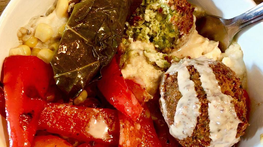 Mediterranean Quinoa Bowl · Gluten free. Vegetarian. Quinoa, babagannush, roasted red peppers, hummus, corn, falafel.