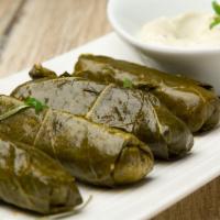 Stuffed Grape Leaves · Stuffed with rice, garlic and dill, served warm with tahini.