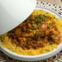 Moroccan Chicken Tajine · Goffle farm free-range braised chicken, couscous, eggplant, preserved lemon apricots and cur...