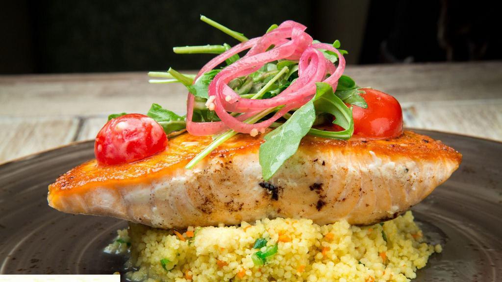 Pan Seared Salmon · Served over vegetable couscous, topped with grape tomato salad & citrus