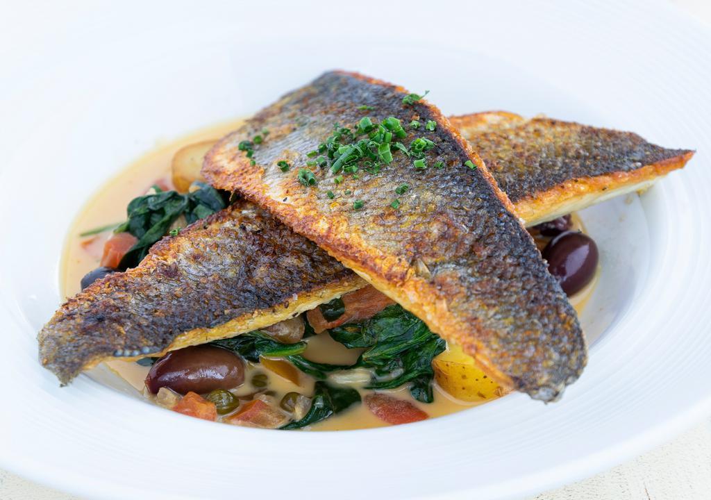Sautéed Branzino · Tomato, spinach, capers, olives, fingerling tomatoes, sherry wine and lemon.