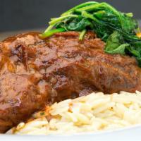 Braised Colorado Lamb Shank · Domestic Colorado lamb served with creamy orzo, spinach and lamb jus.