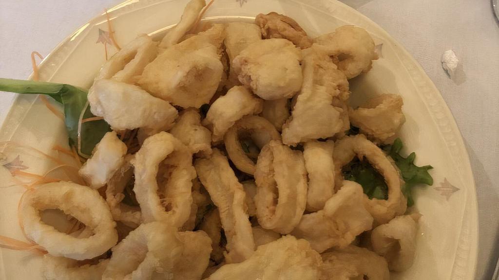 Fried Calamari · deep fried calamari tubes served with a spicy marinara sauce.