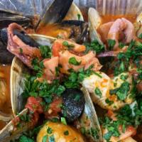 Zuppa Di Mare · Mixed seafood over linguini pasta.