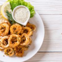 Fried Calamari With Vodka Sauce · Delicious calamari, spiced, and fried to golden perfection. Served on vodka sauce.