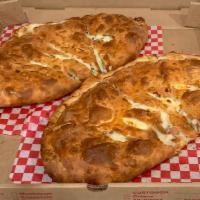 Large Specialty Calzone · A half moon shaped cheese  pocket with a variety of choices to pick from.