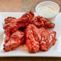 Buffalo  Mild Wings  · This wings are  made with mild buffalo sauce. with choice for dipping sauce. Each 10 pcs. co...