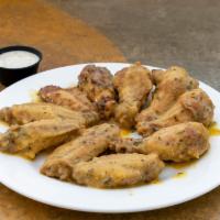 Garlic Parmesan  Wings  · This wings are made with fresh garlic and parmesan cheese.. Each 10 pcs. comes with 1 dippin...