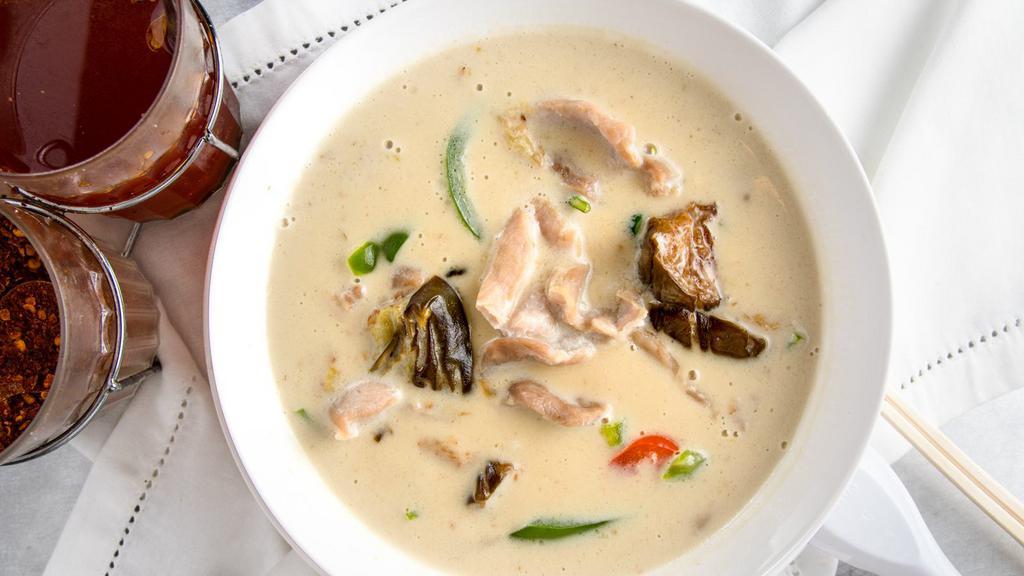 Green Curry · Green curry in coconut milk, bell pepper, eggplant, and basil.