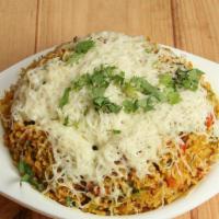 Cheese Pulav · Basmati rice with signature spices and vegetables and cheese on top.