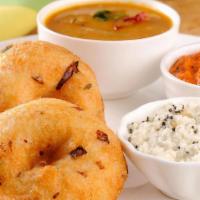 Medu Vada · South Indian fritter in doughnut shape, with a crispy exterior and soft interior.