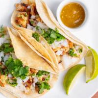 Chicken Tacos · 2 marinated chicken tacos, onion, cilantro, Lot45 hot sauce.