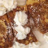 Challah French Toast · Topped with cinnamon and powdered sugar.