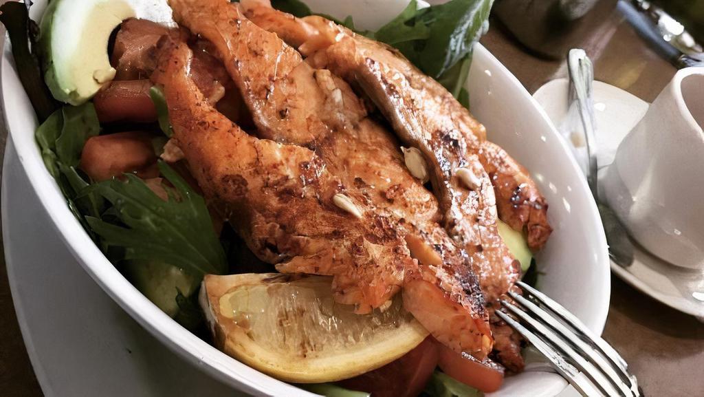 Grilled Salmon Salad · Over mesclun green with tomatoes, red onion, cucumbers and avocado with honey dijon.