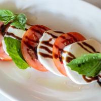 Caprese · Layers of mozzarella | tomatoes | basil | balsamic and olive oil.