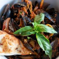 Mussels · French mussels in white wine and herbs or marinara garlic hot sauce.
