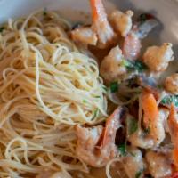 Shrimp Scampi · Over angel hair pasta in a white wine, butter, garlic sauce bath.