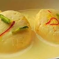 Ras Malai · Cooked cottage cheese soaked in sweetened milk with nuts.