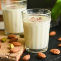 Badam Milk · Creamy almond milk with almond slivers.