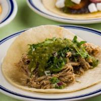 Roast Pork Taco · Citrus marinated roast pork, cilantro, red onions & chipotle mayo & salsa verde