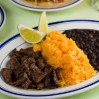 Grilled Marinated Skirt Steak Plate · Steak marinated in citrus, cilantro, shallots, soy and garlic. Served with rice & beans