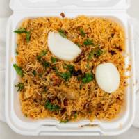 Chicken Dum Biryani · Long-grained rice flavored with exotic spices, layered with chicken, garnished with fried on...