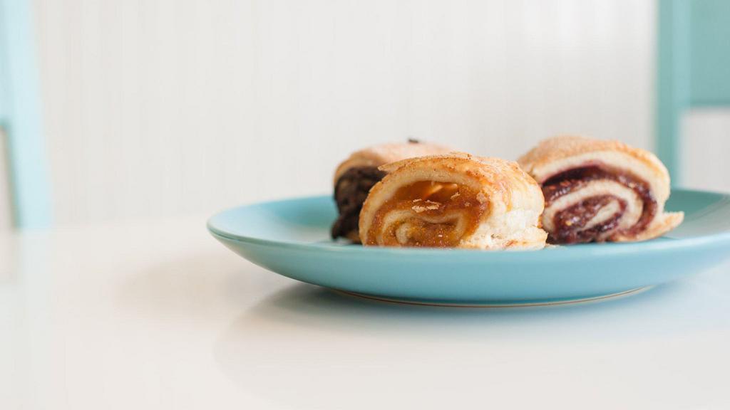 Rugelach  · Light a fluffy cookie meets pastry, filled with Chocolate, Raspberry, Apricot and Seasonal flavors. Roll with this traditional with a twist cookie