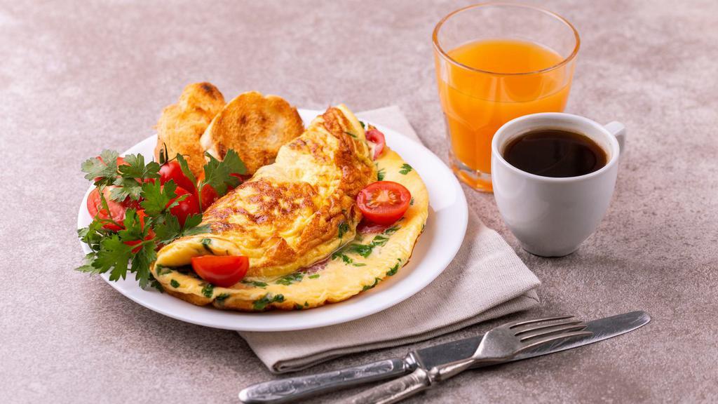 Western Omelette · Fresh omelette made with diced ham, peppers, ham, and cheese.