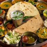 Vatan Special Thali · Three vegetables, one kathol, rice, khichdi, kadhi, dal, pickle, jaggery, garlic chutney, sw...