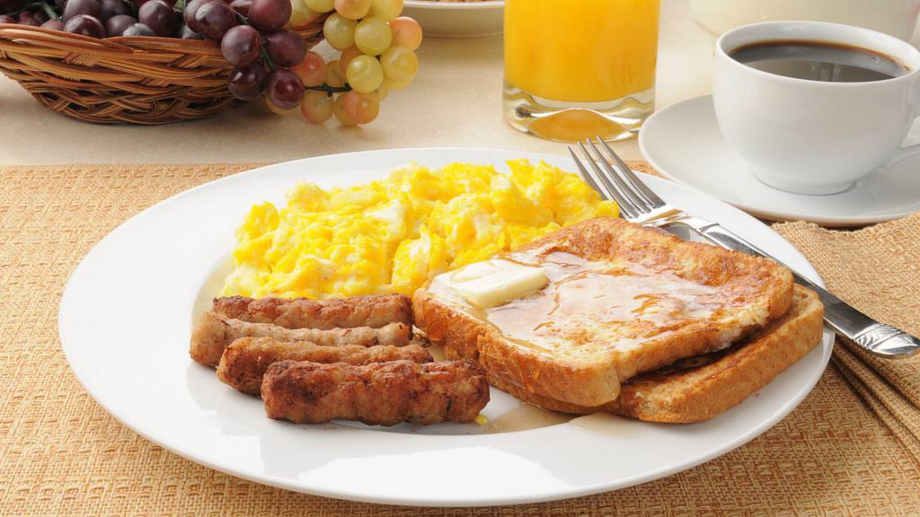 Ultimate Turkey Bacon French Toast With Syrup · Delicious french toast made with cinnamon, eggs, and vanilla extract comes with crispy turkey bacon, served with syrup.