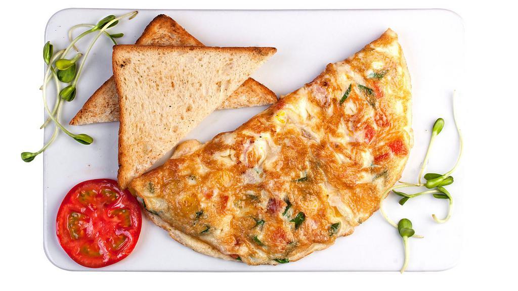 Ham Omelette Platter · Delicious omelette with yummy ham served with home fries and toast.