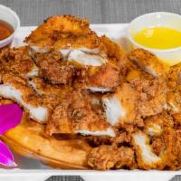 Chicken And Waffles · Chicken and thick cake made from leavened batter or dough.