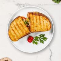 Chunky Club Panini · Grilled chicken, lettuce, tomato, bacon, and muenster cheese on your choice of toasted bread.
