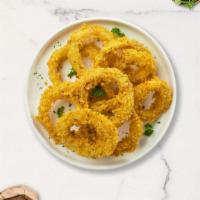 Onion Rings · Freshly cut onions lightly battered and fried until golden crisp. Served with marinara sauce.