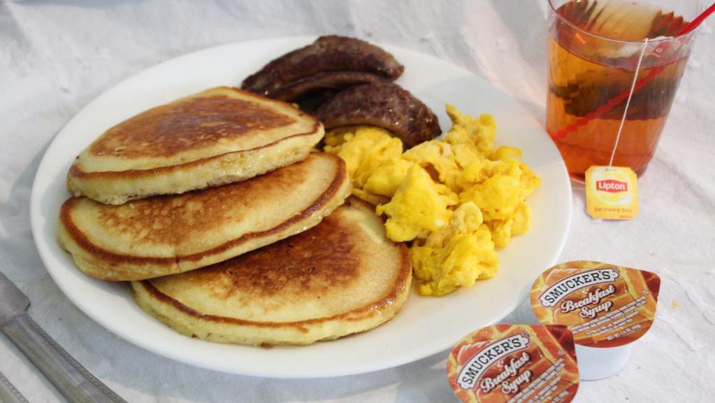 Pancakes · w/2 eggs, choice of bacon, sausage or ham ,choice of 8 oz.reg.coffee,reg. sm. tea or sm. juice