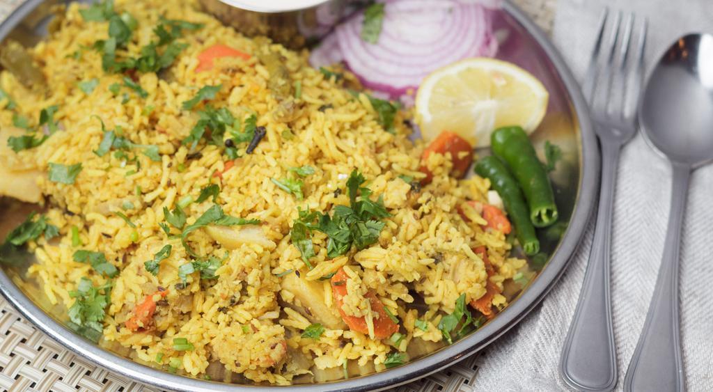 Vegetable Fried Rice · Spicy. Basmati rice cooked with spring onions, cabbage, carrots, green peas & spices.