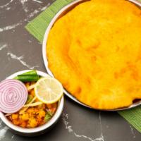 Chana Bhatura · Not Gluten-Free. Large puffed bread made of all-purpose flour
served with chickpeas and spi...