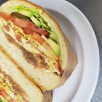 (H). Chorizo And Eggs Torta · Chorizo omelette, with Oaxaca Cheese, lettuce, tomatoes, jalapeno, avocado,beans, and mayo.