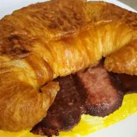 Croissant Sandwich · All croissants are served with egg & cheese. Your choice of bacon, ham, turkey, salami,
or j...