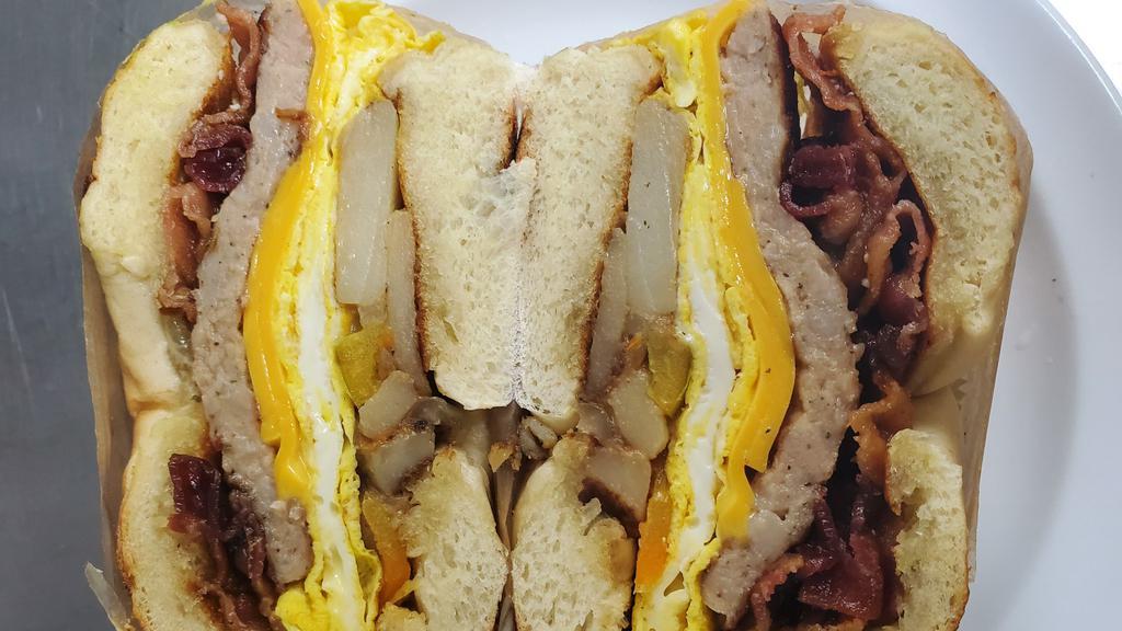 Weird Sandwich · Turkey bacon, sausage patty, home fries, eggs, cheese, butter, jelly on a toasted bagel.