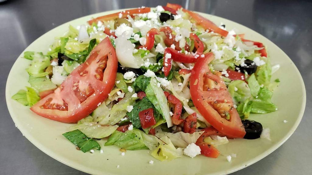 Greek Salad · Feta, olives, lettuce, tomatoes, onion, peppers,cucumber mix with oil and vinegar, salt, pepper, oregano.