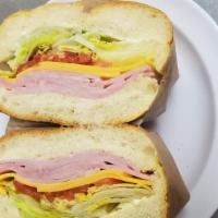 Ham & Cheese Sandwiched · Lettuce, tomatoes on roll.