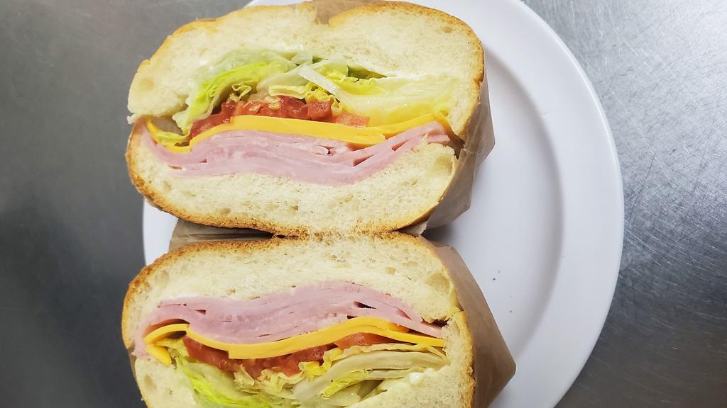 Ham & Cheese Sandwiched · Lettuce, tomatoes on roll.
