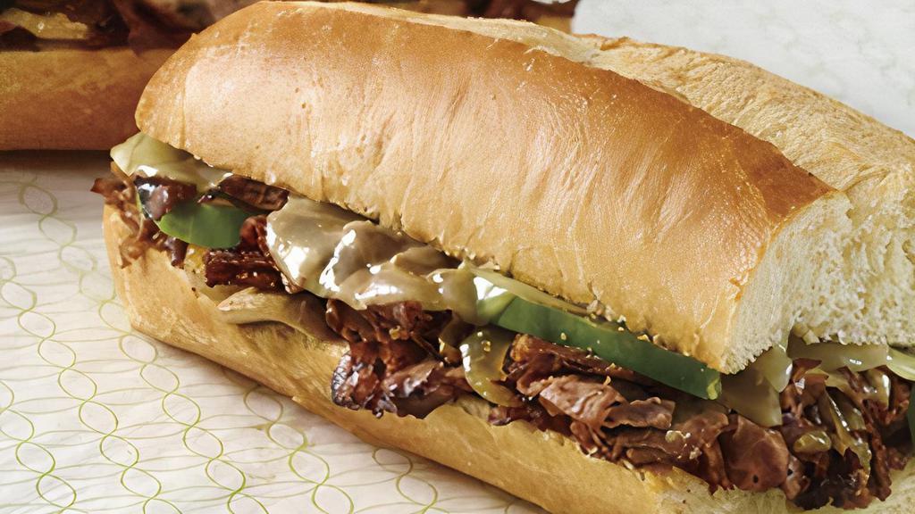 (Small) Steak Sub  · Steak cooked with green peppers onions topped with cheese  Lettuce and tomatoes mio