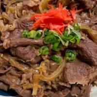 Gyudon (Beef Rice Bowl) · Thinly sliced beef w onion simmered in a dash sweet soy sauce over the rice